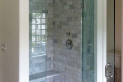 Custom glass shower door with steam shower enclosure