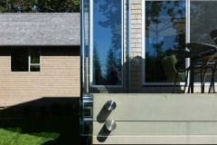 Custom glass railing, exterior private residence in Darien