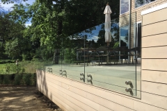 glass railing along porch front glass fence